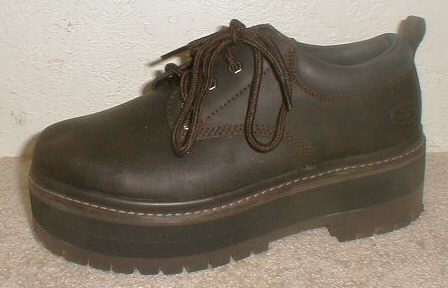 Men's casual shoe with a professionally installed orthopedic shoe lift.